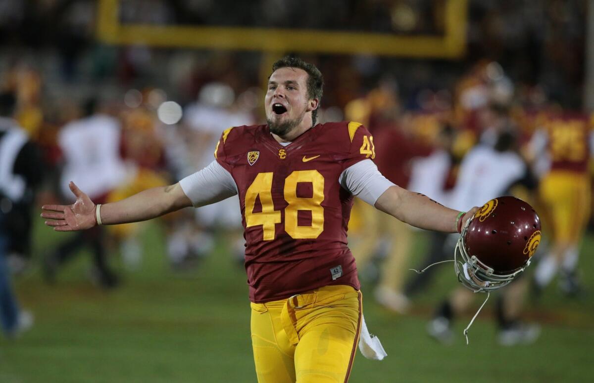 USC kicker Andre Heidari celebrates after the Trojans' 20-17 upset win over Stanford at the Coliseum on Saturday.