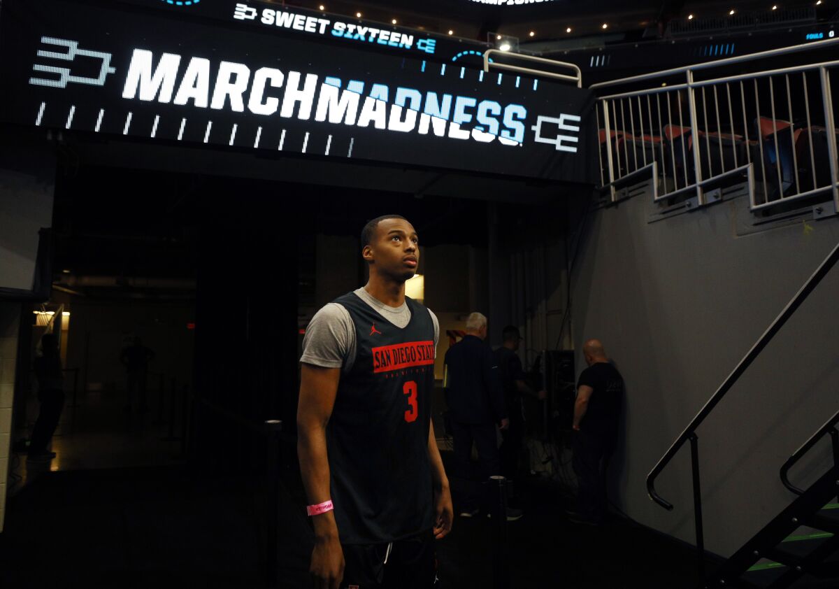 San Diego State's Micah Parrish walks into the arena for a practice in Louisville on Thursday, March 23, 2023.