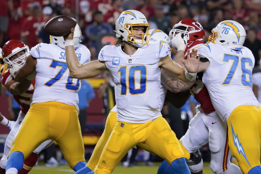Los Angeles Chargers quarterback Justin Herbert (10) passes against the Kansas City Chiefs during an NFL football game Thursday, Sept. 15, 2022, in Kansas City, Mo. (AP Photo/Ed Zurga)