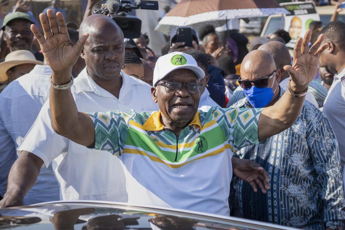 Former president of the African National Congress and South Africa, Jacob Zuma, waves to supporters.
