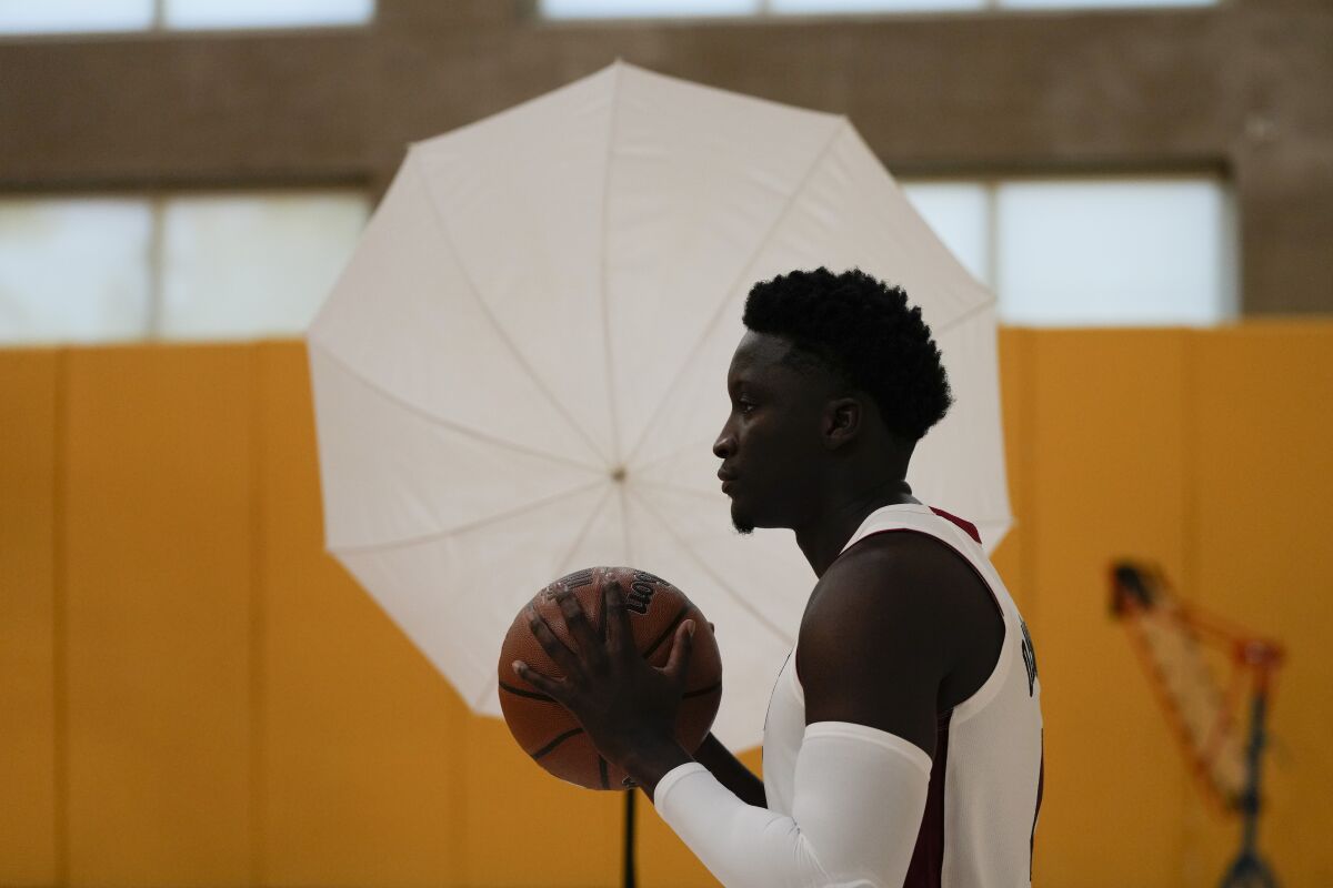 Miami Heat's Victor Oladipo poses for a photo during the NBA basketball team's Media Day in Miami, Sept. 27, 2021. The Heat are listing Oladipo as questionable for their Monday, March 7, 2022 game against the Houston Rockets. Officially, that means there’s a 50-50 chance of the two-time All-Star playing for the first time in nearly a year, and the expectation is that — barring any last-second setback — his return is about to happen. (AP Photo/Rebecca Blackwell)