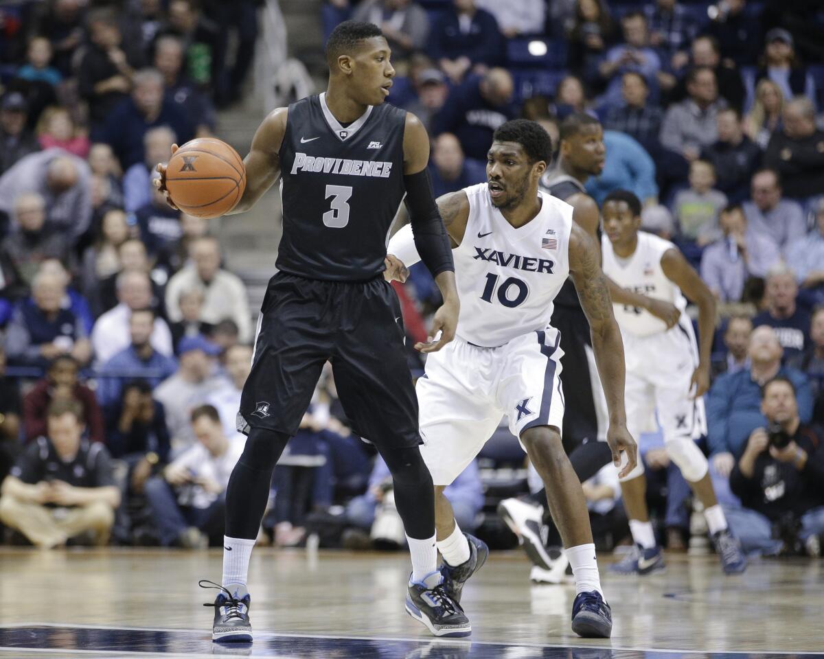 Providence guard Kris Dunn looks to pass against Xavier guard Remy Abell during the first half of a game on Feb. 17.