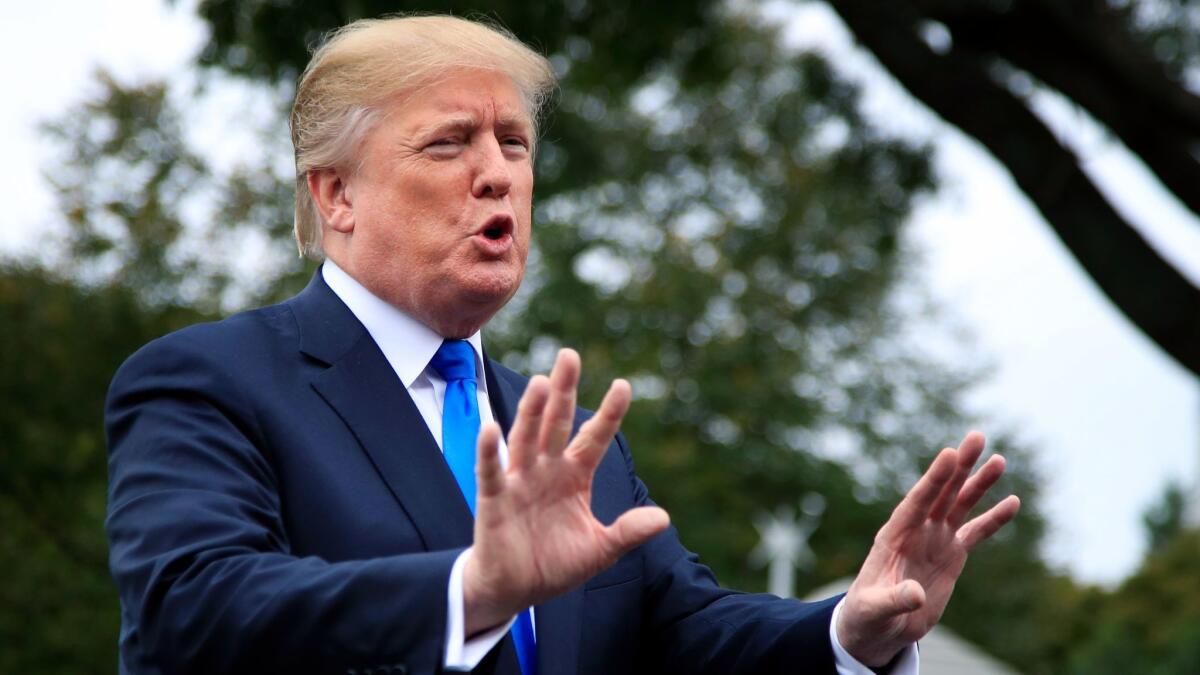 President Trump speaks to reporters on the South Lawn of the White House in Washington on Oct. 13.