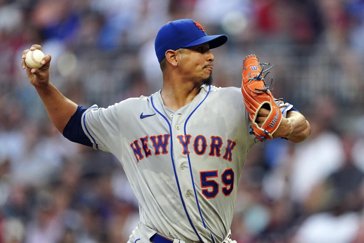 New York Mets starting pitcher Carlos Carrasco delivers in the first inning of the team's baseball game against the Atlanta Braves on Monday, Aug. 15, 2022, in Atlanta. (AP Photo/John Bazemore)