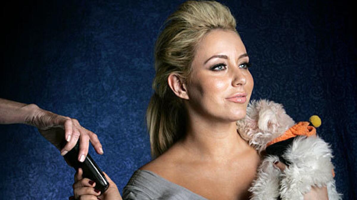 Aubrey O'Day, formerly of music group Danity Kane, and her dog Ginger.