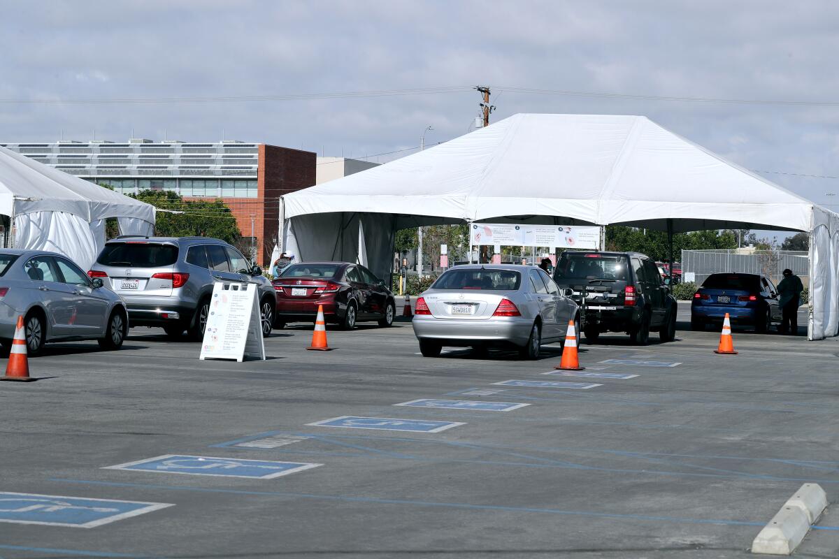 Vehicles line up at the COVID-19 testing super site at the Orange County Fair and Event Center in Costa Mesa on Jan. 22.