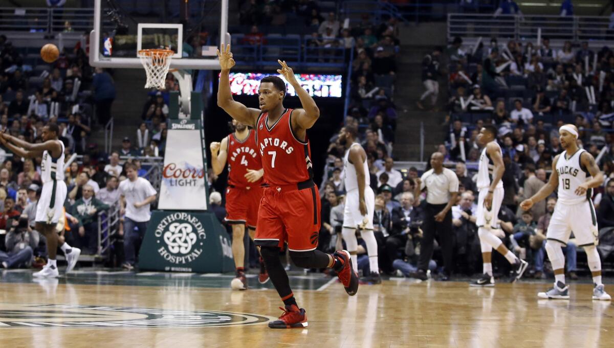 Raptors guard Kyle Lowry (7) reacts after making a three-point basket against the Bucks during the second half.
