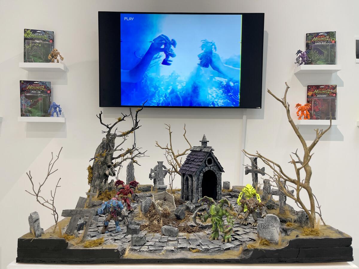 Matthew Newman, "Gorehoundz Action Figures and display," 2021, cardboard, plastic, resin figure.