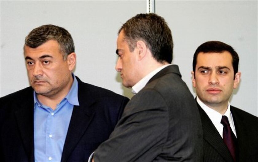 Three leaders of Georgia's disparate opposition coalition, from left, Levan Gachechiladze, Kakha Shartava and Irakli Alasania, seen during their meeting with President Mikhail Saakashvili, not seen, in the capital Tbilisi, Monday, May 11, 2009. The much-anticipated talks, which followed a month of street protests by demonstrators demanding Saakashvili's resignation, ended without agreement, negotiators said. (AP Photo/Irakly Gedenidze, Presidential Press Service, Pool)