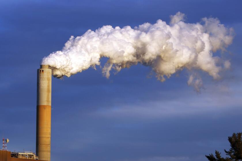 In this Jan. 20, 2015, photo, steam billows from the coal-fired Merrimack Station in Bow, N.H.