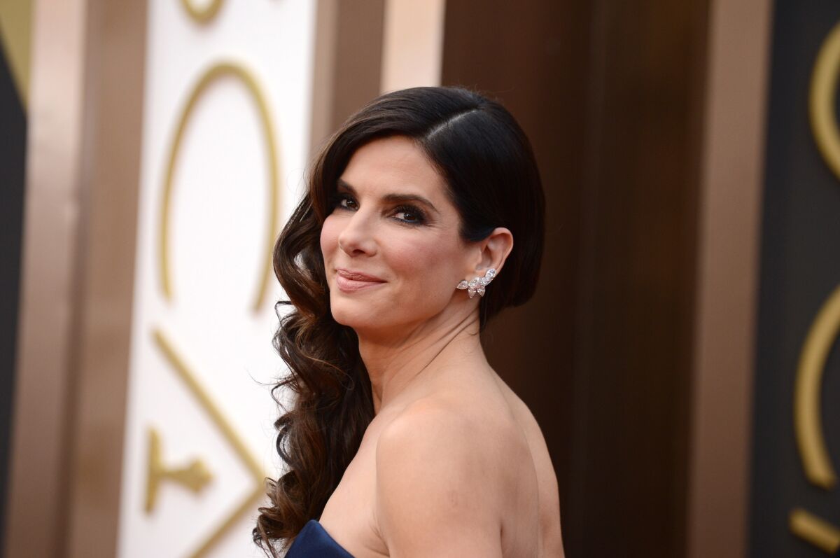 People magazine has named Sandra Bullock the "World's Most Beautiful Woman" for 2015. She is pictured at the 2014 Academy Awards ceremony.