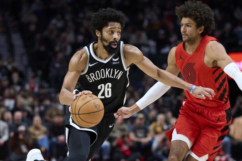 Brooklyn Nets guard Spencer Dinwiddie drives against Portland Trail Blazers guard Matisse Thybulle.