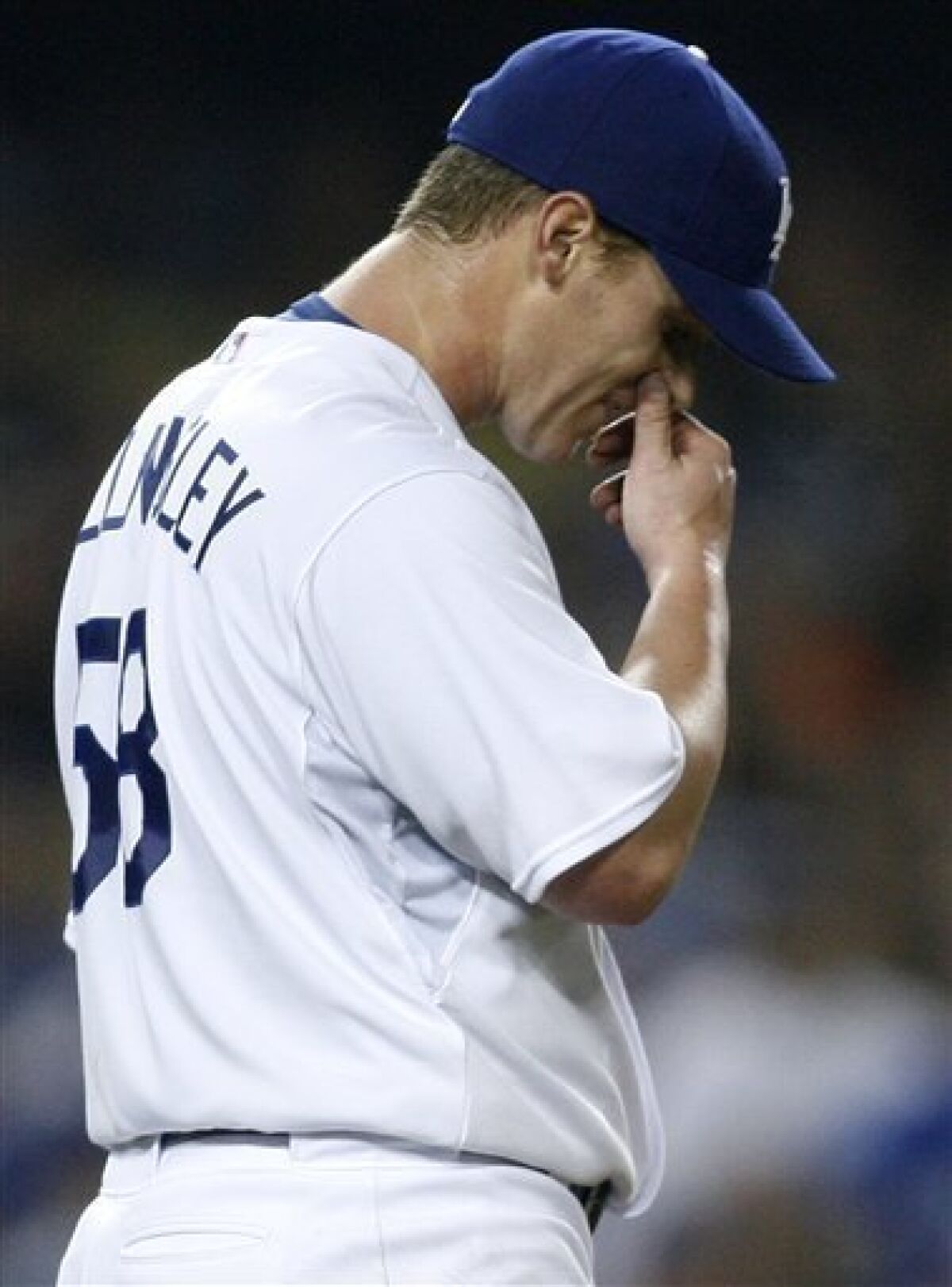 Los Angeles Dodgers starting pitcher Chad Billingsley reacts after San Francisco Giants' Pablo Sandoval hit an infield single to score Emmanuel Burriss during the seventh inning of an MLB baseball game in Los Angeles on Friday, May 8, 2009. (AP Photo/Danny Moloshok)