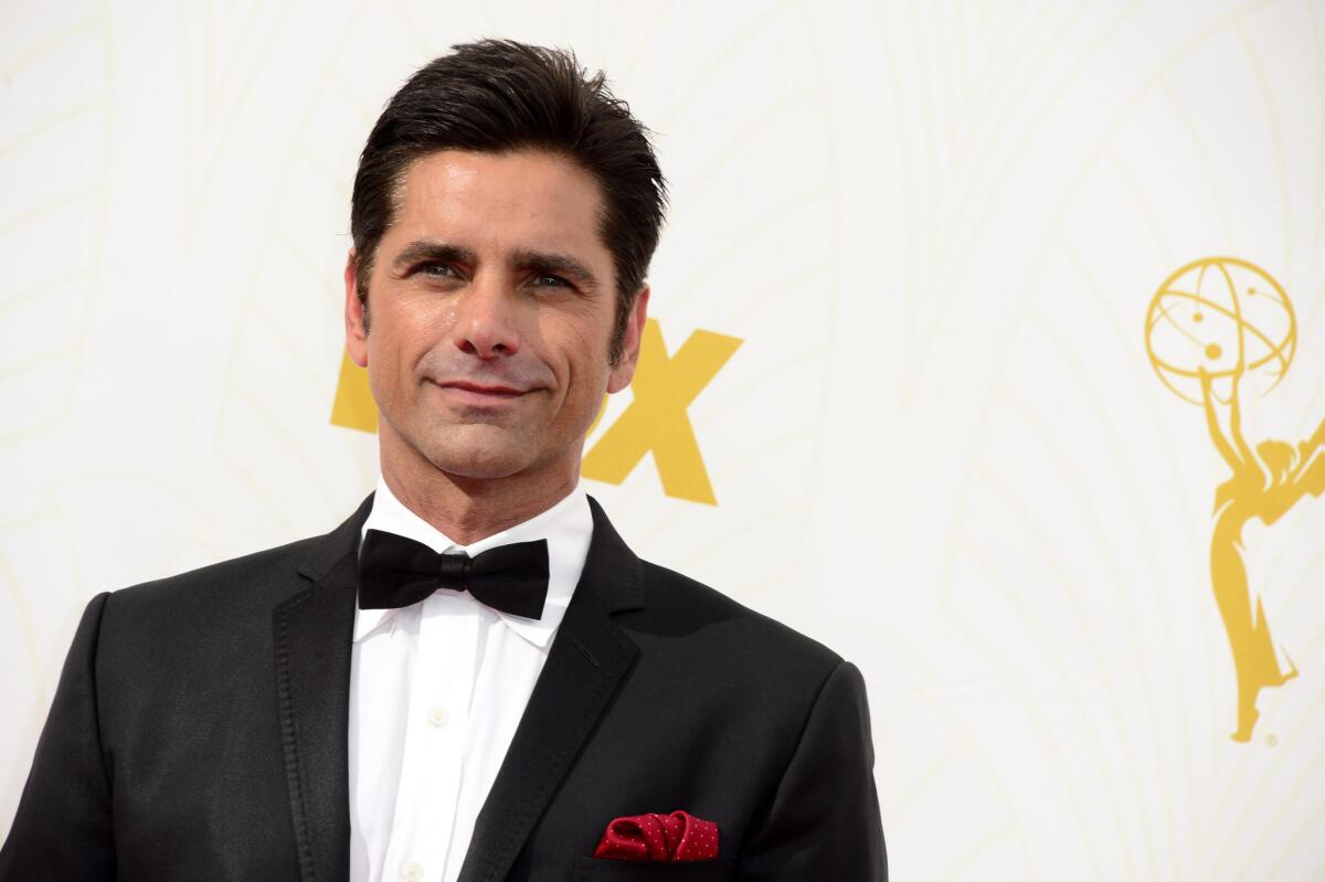 John Stamos arrives for the 67th Primetime Emmy Awards at the Microsoft Theater in Los Angeles on Sept. 20.