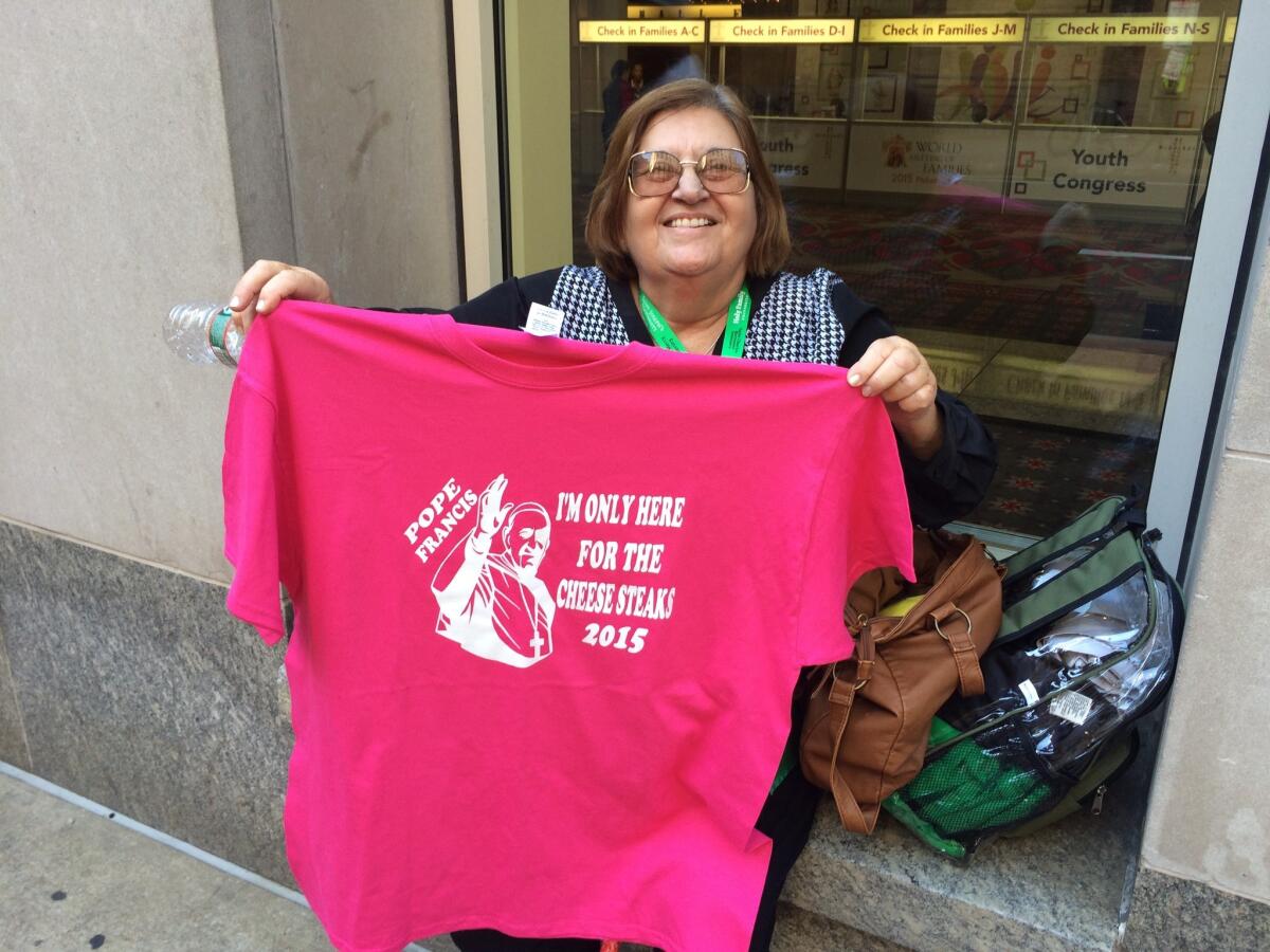 Marta Priede, 68, came to Philadelphia from West Palm Beach, Fla., to see the pope. On Wednesday, she bought souvenirs, including this T-shirt and a button that says, "I was there."