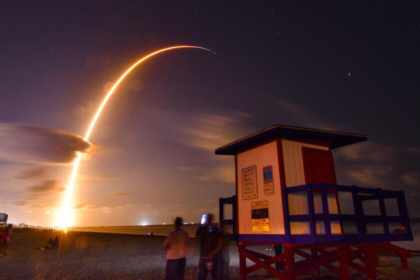 A Falcon 9 SpaceX rocket with a payload of 60 satellites for SpaceX's Starlink broadband network, lifts off from Space Launch Complex 40 at Florida's Cape Canaveral Air Force Station, Thursday, May 23, 2019. A 149 second time exposure of the launch Thursday night is viewed from the end of Minutemen Causeway in Cocoa Beach, Fla. (Malcolm Denemark/Florida Today via AP)