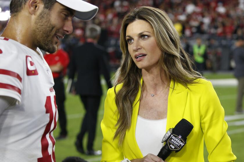 Fox sideline reporter Erin Andrews speaks with San Francisco 49ers quarterback Jimmy Garoppolo after an NFL football game against the Arizona Cardinals, Thursday, Oct. 31, 2019, in Glendale, Ariz. The 49ers won 28-25. (AP Photo/Ross D. Franklin)