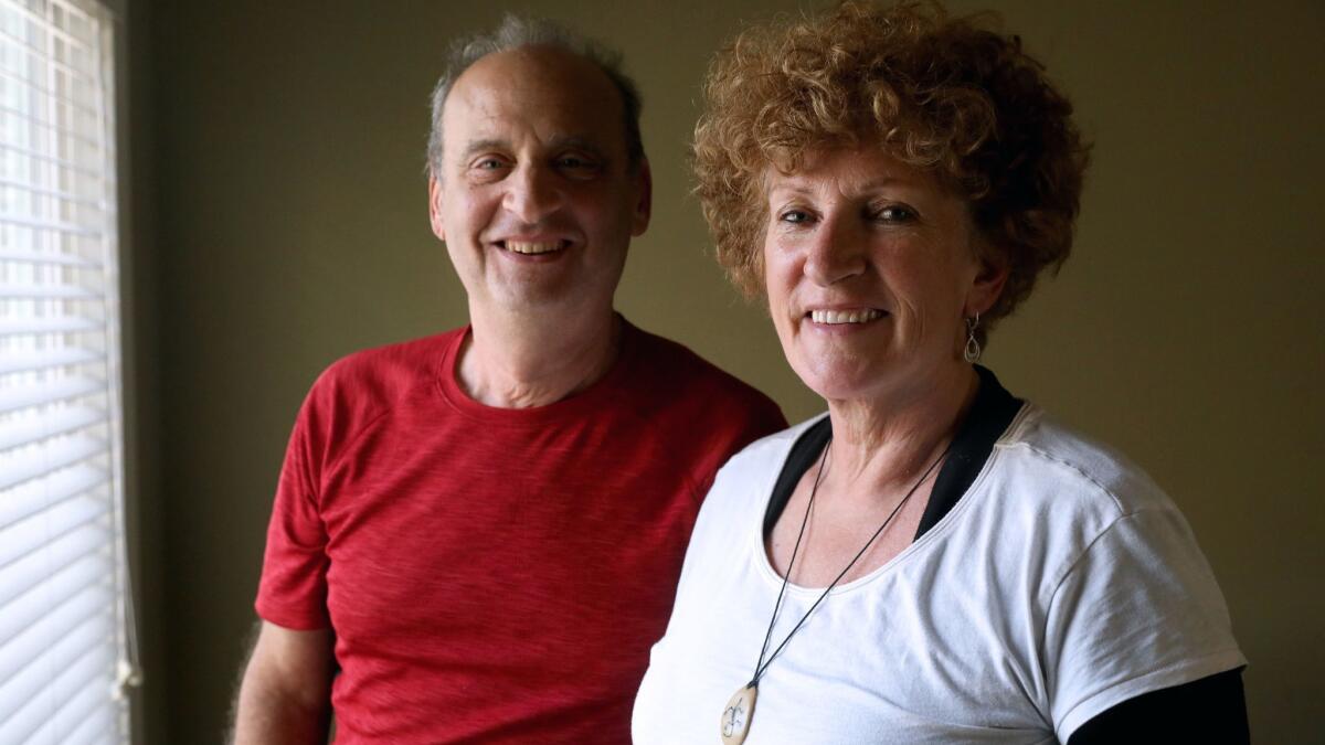 Joe Schellenberg, left, and wife Mieke VanHout, of Concord, Calif., sponsor refugees seeking asylum.