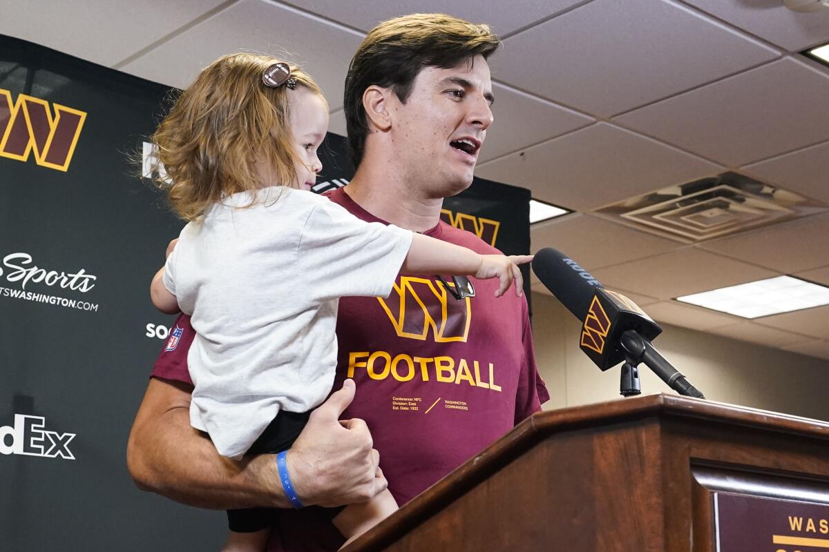 Washington Commanders punter Tress Way (5) meets with fans after