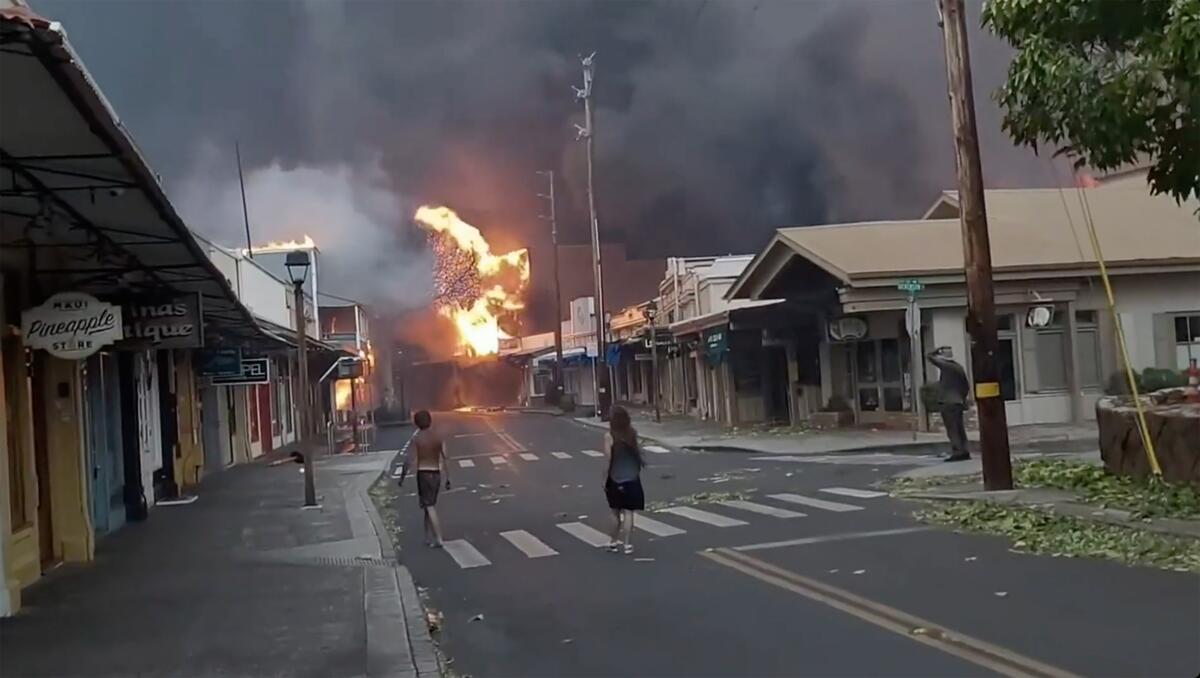 Fire burns on Front Street in downtown Lahaina, Maui. 