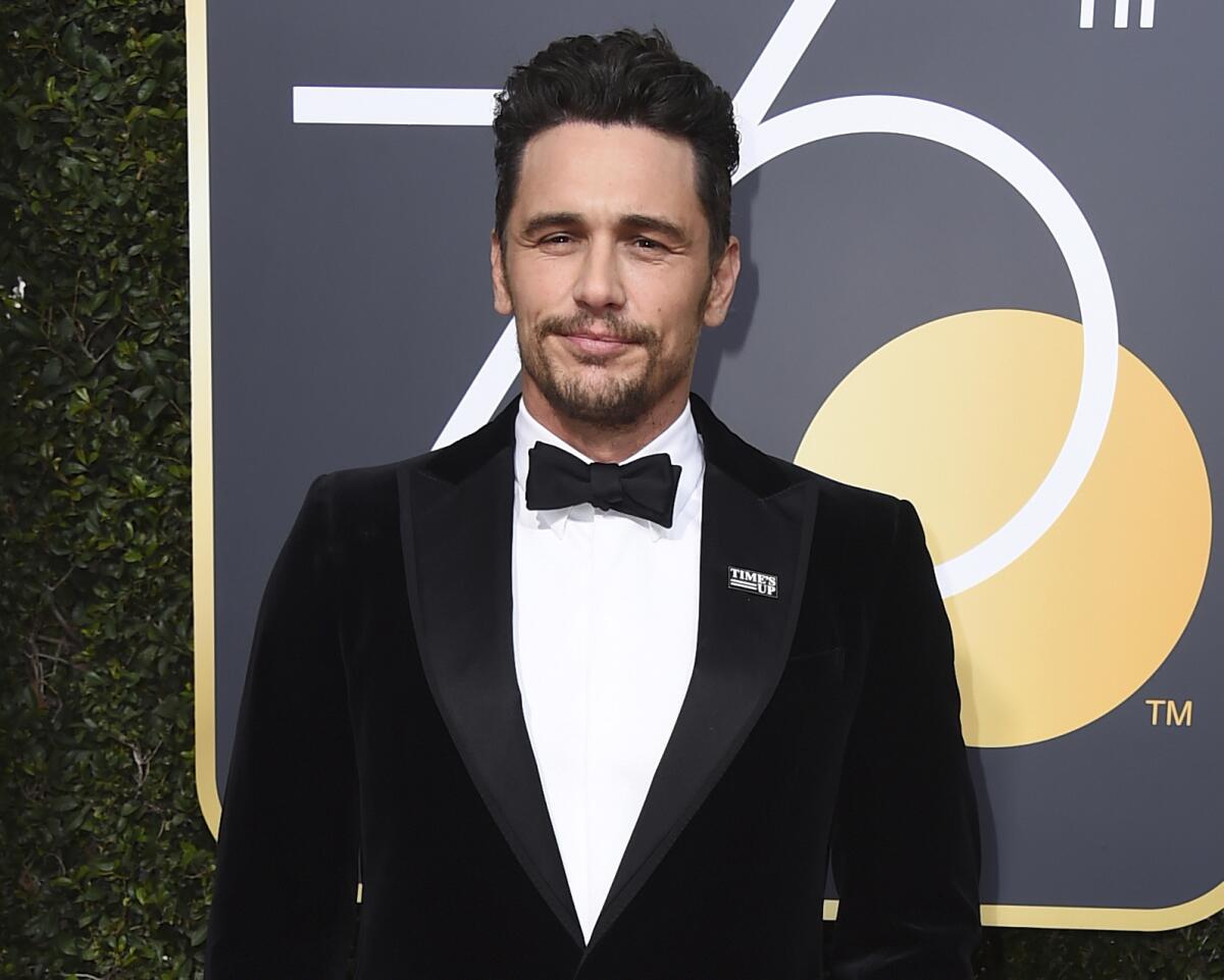 James Franco appears at the Golden Globe Awards wearing a Time's Up pin.