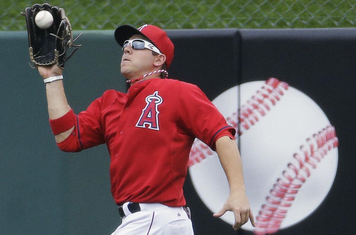 Angels outfielder J.B. Shuck catches a fly ball during an exhibition game against the Dodgers in March. Shuck's throwing accuracy and quick release makes him a threat to baserunners.