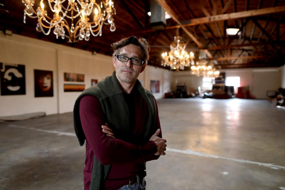 Peter Mozgo, 49, operator of the Hungarian Cultural Center in Los Angeles. Mozgo has placed 140 planters along the perimeter of the center in the 1800 block of South Hope Street to prevent homeless people from setting up tents.