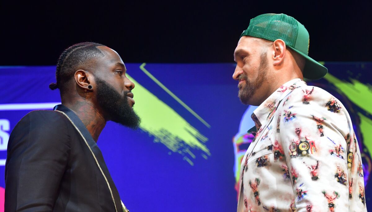 Boxers Deontay Wilder, left, and Tyson Fury face-off during a press conference in Los Angeles on Jan. 13 ahead of their re-match fight in Las Vegas on Feb. 22.