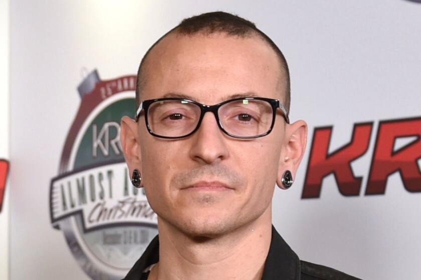 FILE - In this Dec. 13, 2014 file photo, Chester Bennington poses in the press room at the 25th annual KROQ Almost Acoustic Christmas in Inglewood, Calif. The Los Angeles County coroner says Bennington, who sold millions of albums with a unique mix of rock, hip-hop and rap, has died in his home near Los Angeles. He was 41. Coroner spokesman Brian Elias says they are investigating Benningtonâs death as an apparent suicide but no additional details are available. (Photo by John Shearer/Invision/AP, File)