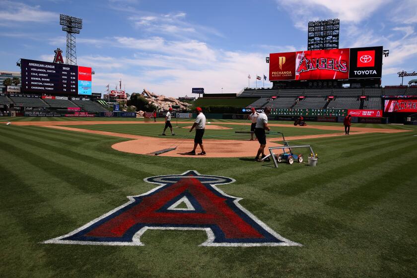 ANAHEIM, CALIFORNIA - AUGUST 18: A general view of the grounds crew preparing the field is seen prior to the MLB game between the Chicago White Sox and the Los Angeles Angels at Angel Stadium of Anaheim on August 18, 2019 in Anaheim, California. (Photo by Victor Decolongon/Getty Images)