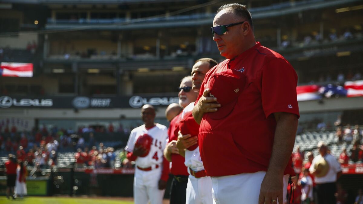 Angels manager Mike Scioscia during the singing of the National Anthem before a game against the Oakland Athletics at Angel Stadium on Sunday. It was Scioscia's last game as manager of the Angels.