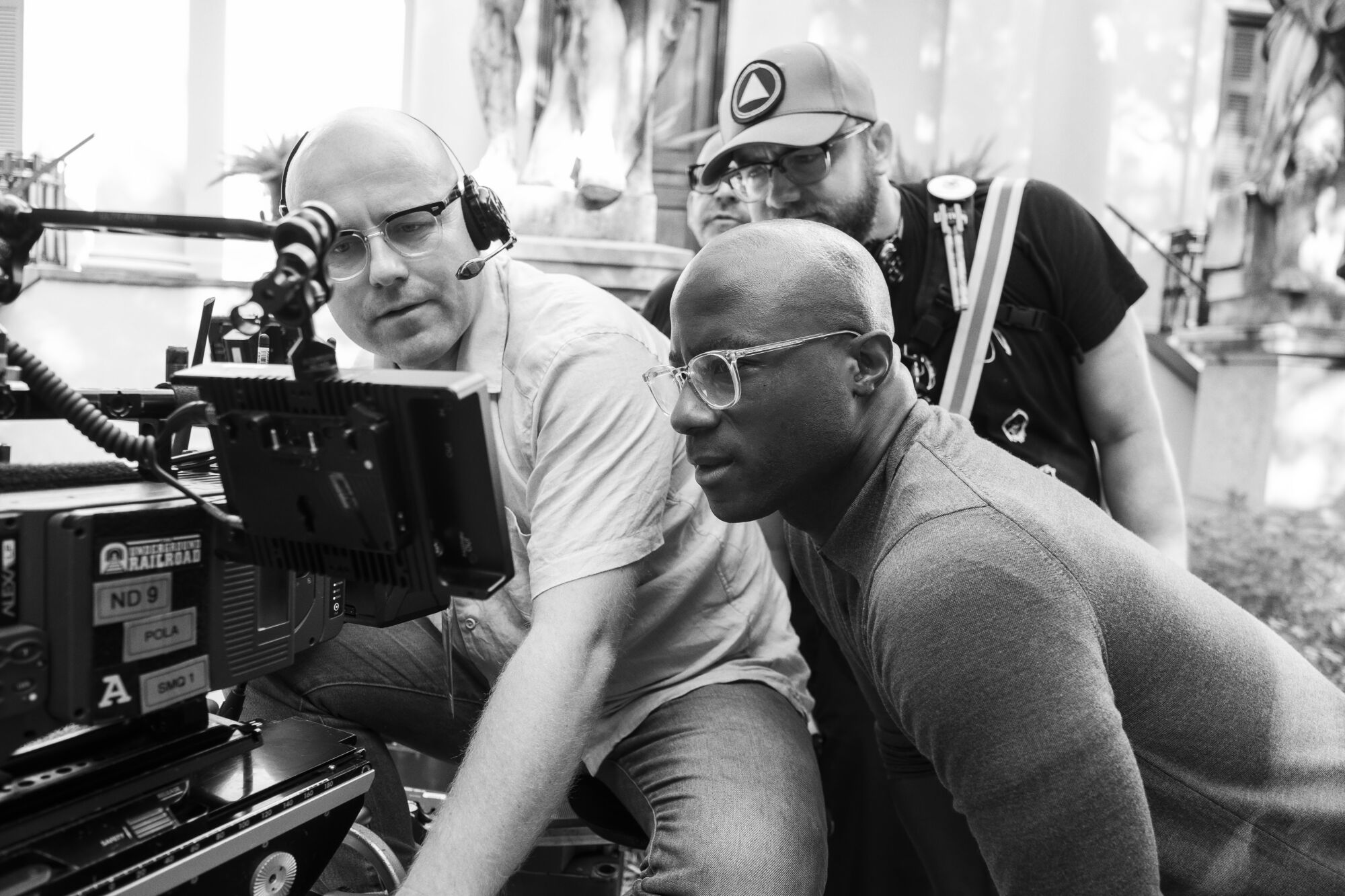 Cinematographer James Paxton and director Barry Jenkins look through the camera while filming "The Underground Railroad."