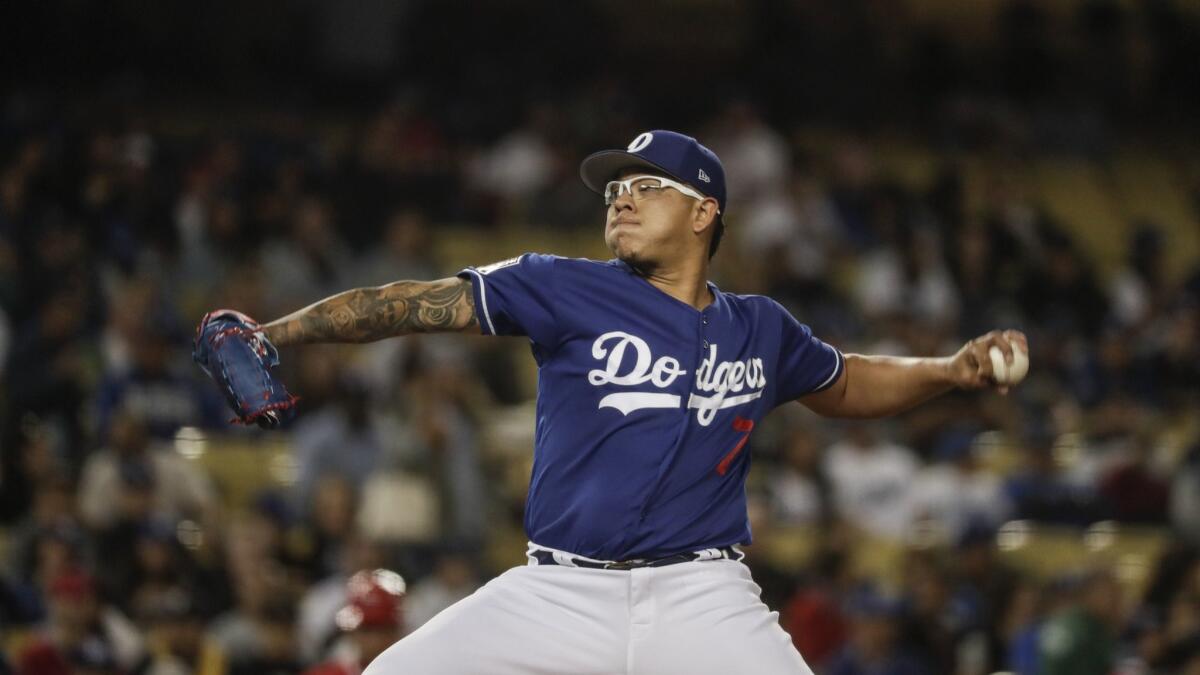 Dodgers pitcher Julio Urias pitches in the third inning in an exhibition game against the Angels at Dodger Stadium on Tuesday.