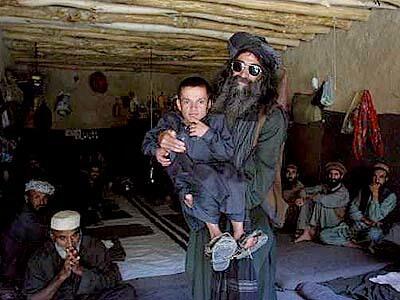 Shermanlang, a Taliban warrior and ethnic Pushtun, who was captured in fighting against the Northern Alliance, is pictured in a Borak prison cell with his cellmate Akhtorali.