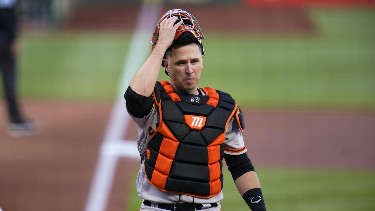 San Francisco Giants catcher Buster Posey looks toward dugout against the Pittsburgh Pirates on May 13.