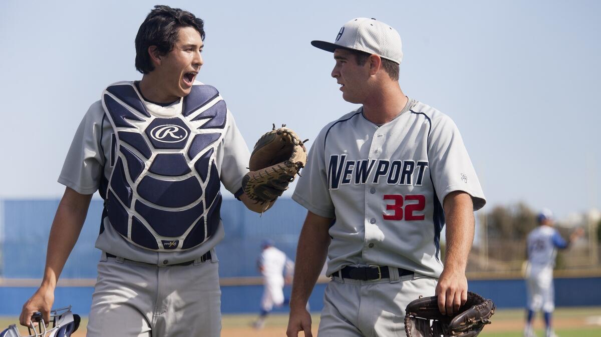 Catcher Max Crabbe, shown talking with pitcher Chaz Perry (32) on April 13, 2016, helped Newport Harbor High beat Edison 10-3 on Friday.