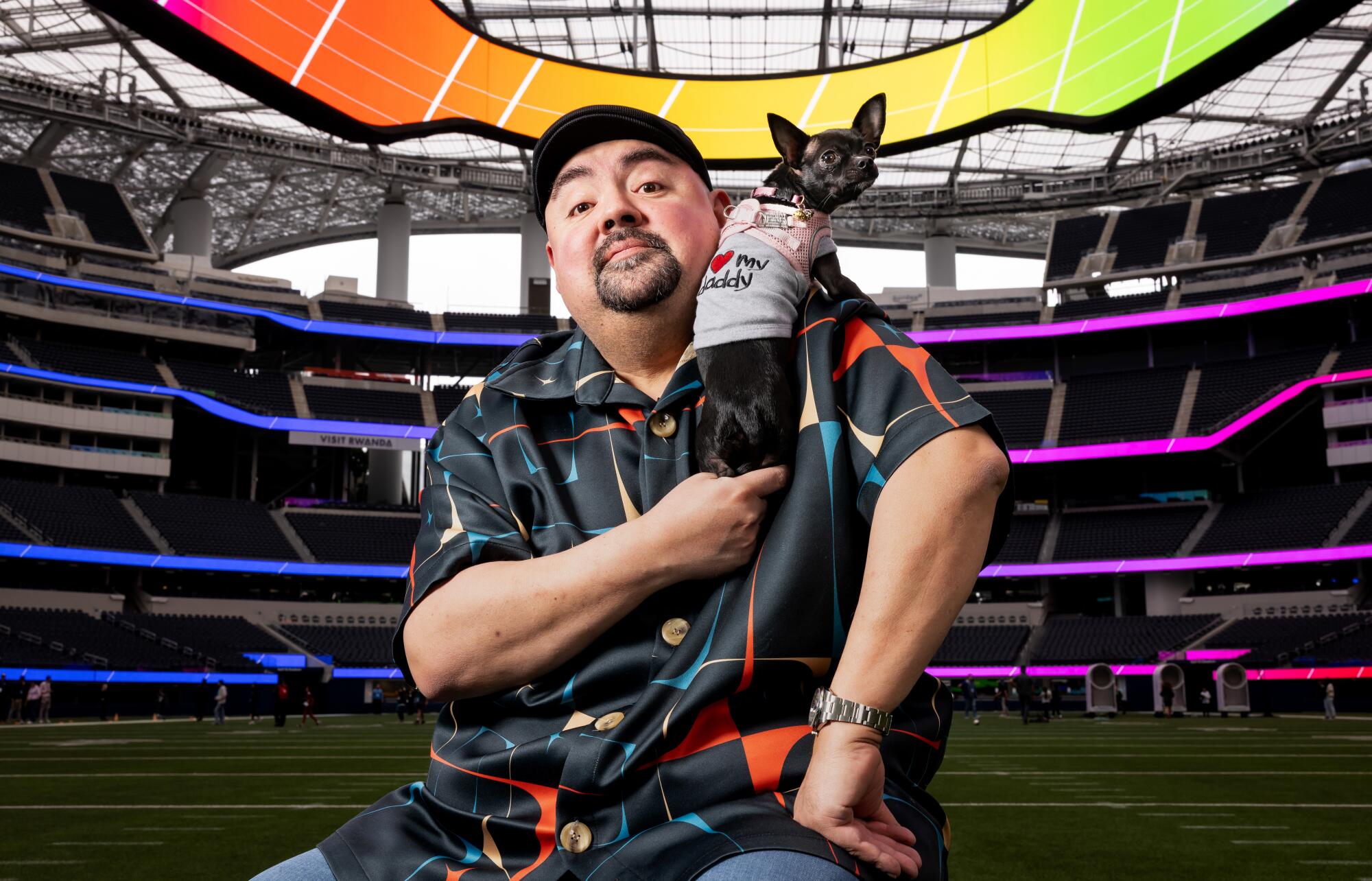 Comedian Gabriel Iglesias, aka, "Fluffy," is photographed with his dog at SoFi Stadium in Inglewood on February 10, 2026.