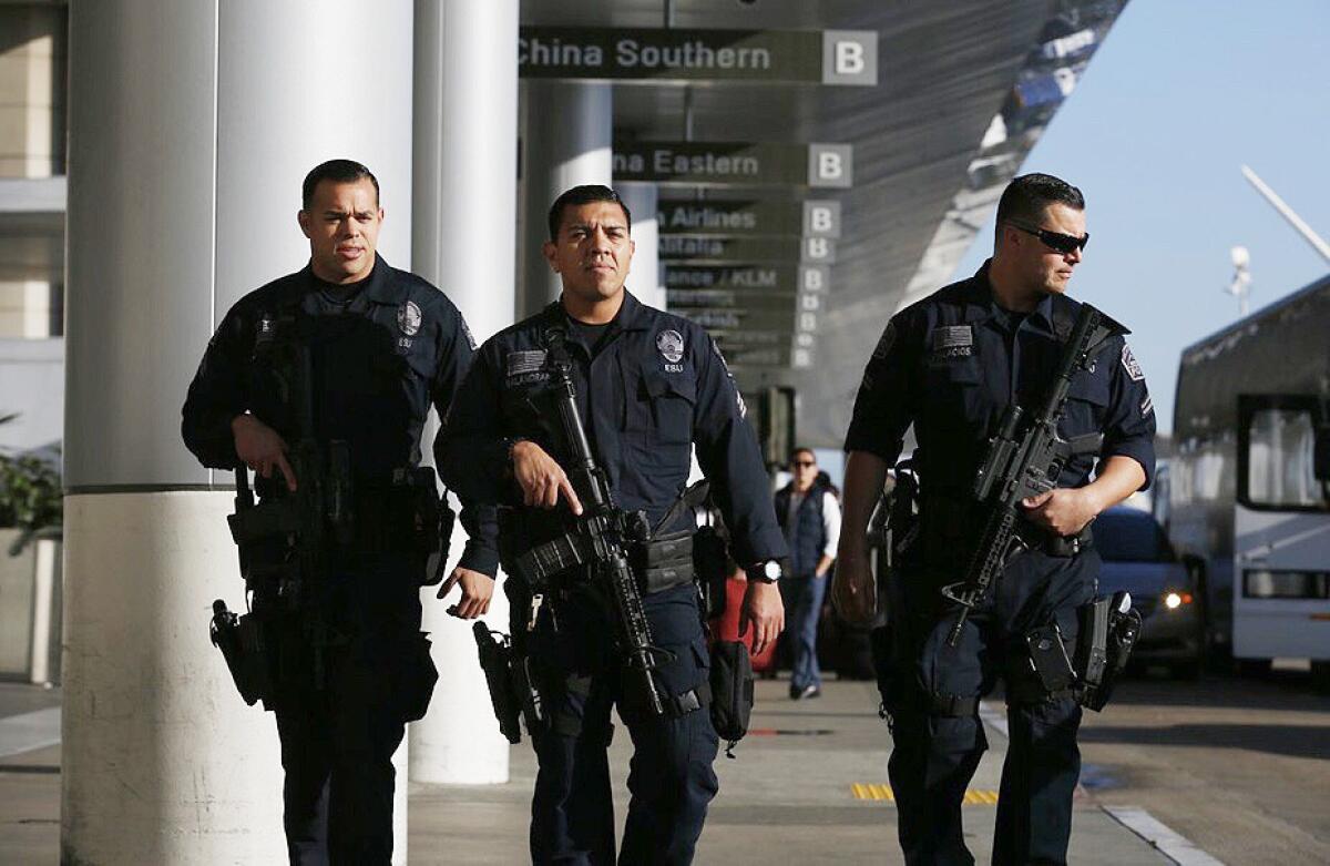 Police at LAX on Tuesday patrolled with automatic weapons.