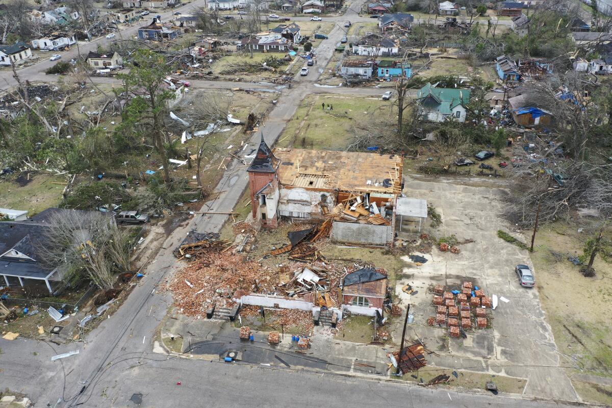 An aerial photo of battered buildings and debris