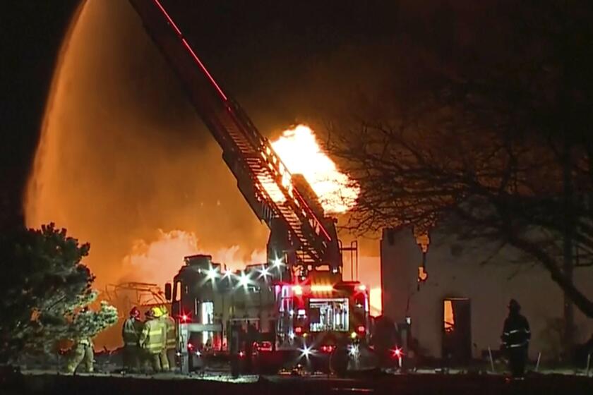 FILE - In this frame grab taken from video provided by WXYZ, firefighters battle an industrial fire in the Detroit suburb of Clinton Township, March 4, 2024. Noor Noel Kestou, a suburban Detroit businessman, was charged with involuntary manslaughter Thursday, April 25, in connection with an explosion at the building he owned in which a nitrous oxide cannister propelled through the air, striking and killing another man. (WXYZ via AP, File)