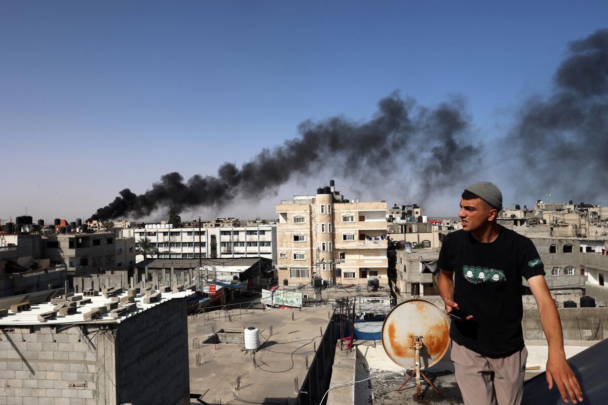 Smoke rises from a fire in a building caused by Israeli bombardment in Rafah in the southern Gaza Strip on May 10.