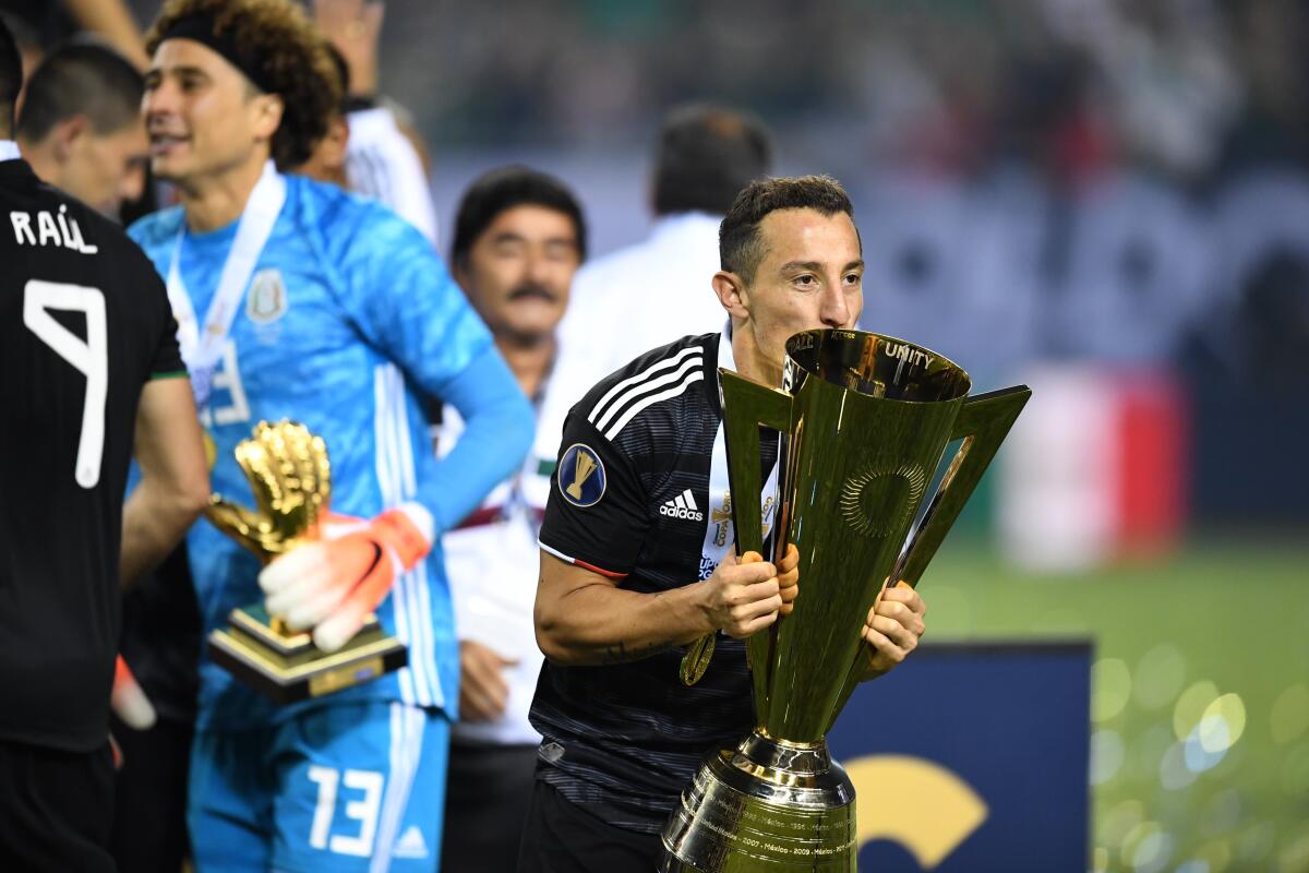 Mexico's midfielder Andres Guardado kisses the Gold Cup after beating the US during the 2019 Concacaf Gold Cup final football match between USA and Mexico on July 7, 2019 at Soldier Field stadium in Chicago, Illinois. - Mexico defeated the US 1-0 (Photo by TIMOTHY A. CLARY / AFP) (Photo credit should read TIMOTHY A. CLARY/AFP via Getty Images)