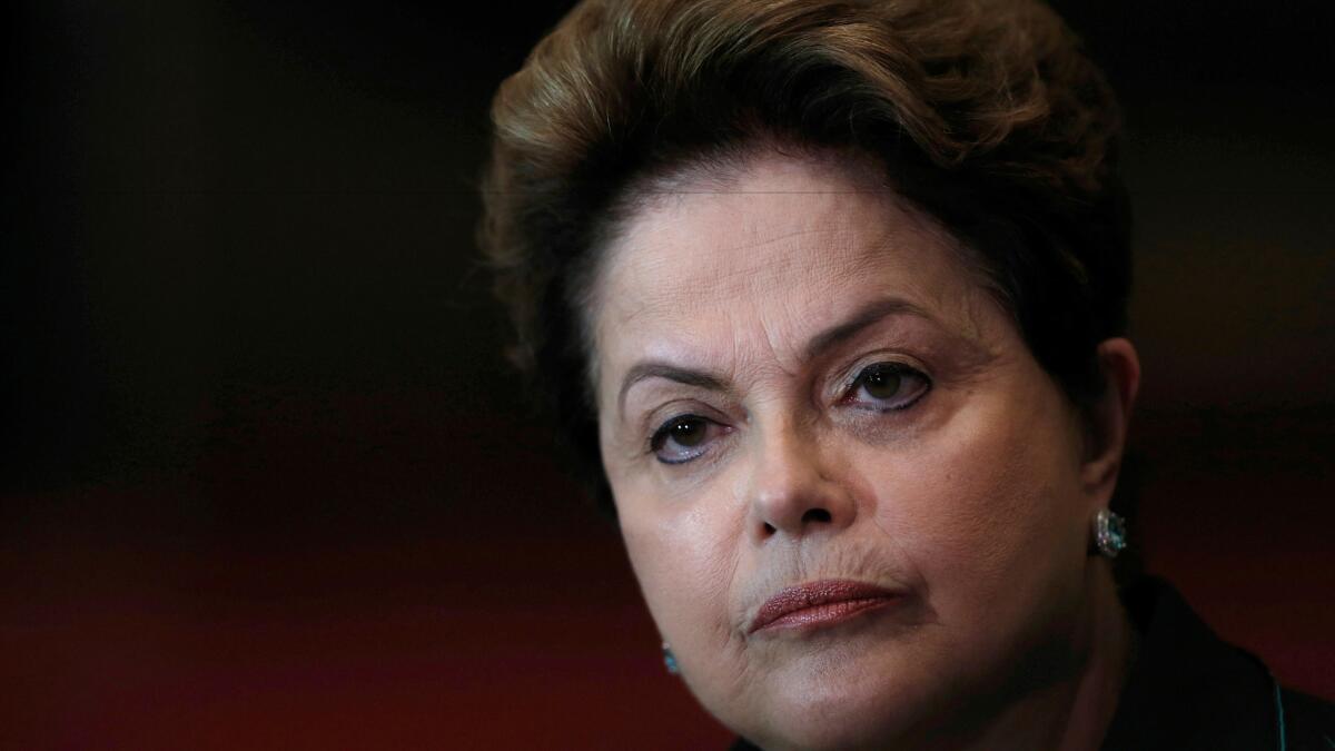 Dilma Rousseff listens to a question during an Oct. 6, 2014, reelection campaign news conference at the Alvorada Palace in Brasilia, Brazil.