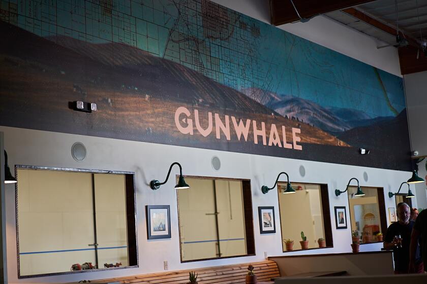 On one of the walls, Gunwhale Ales’ logo is superimposed over artwork depicting a historic lot map of Orange as it existed a century or more ago.