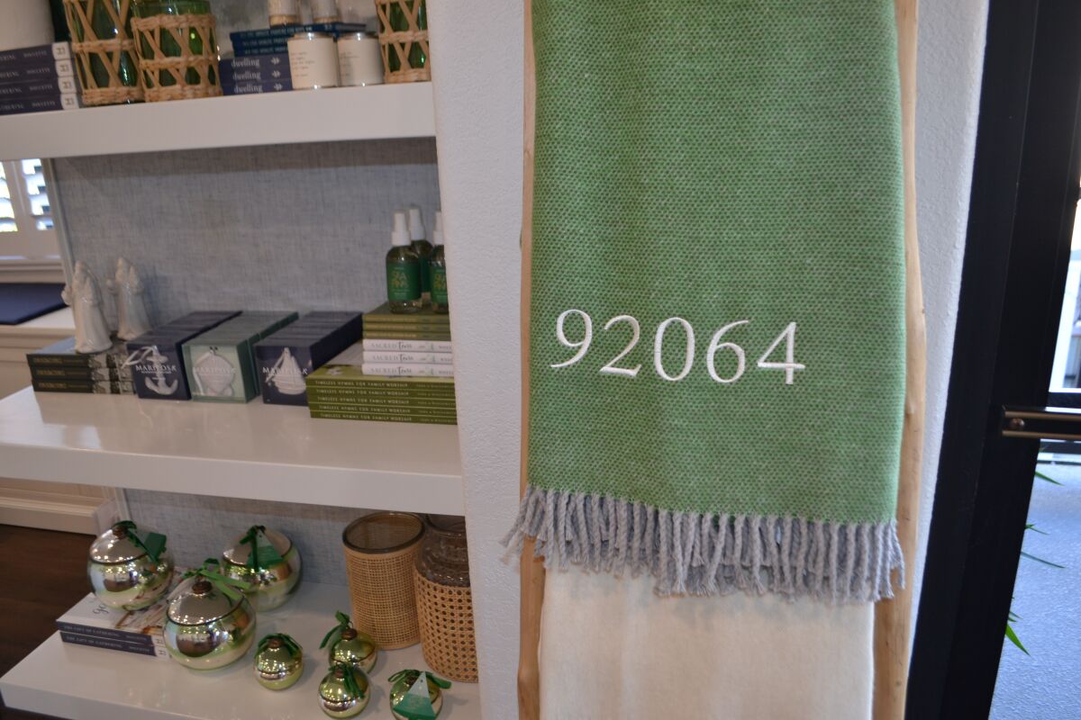Elizabeth Louise Interiors carries personalized gifts such as a 92064 blanket.