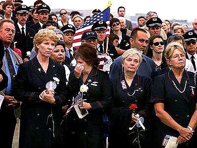 Flight attendants and pilots gather at Dockweiler Beach in Los Angeles for a memorial service for their colleagues killed in the Sept. 11 terrorist attacks.
