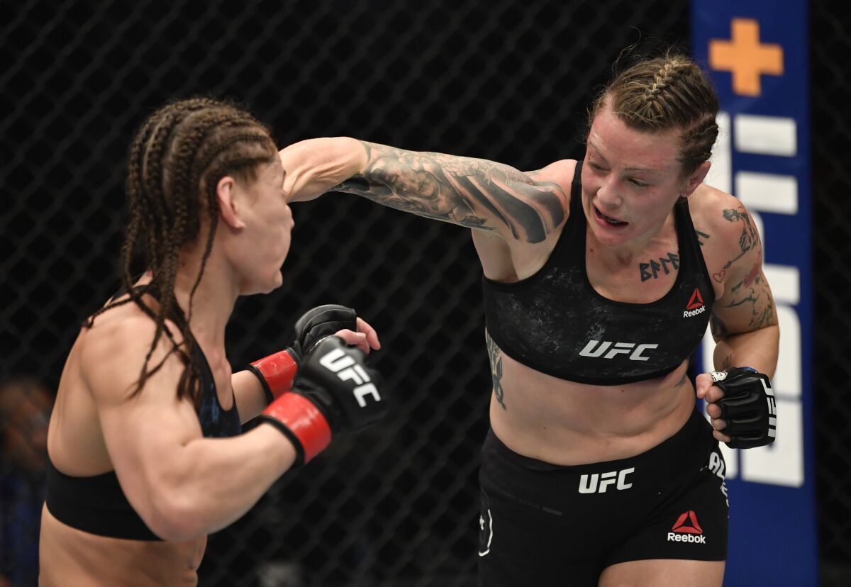Joanne Calderwood, right, punches Jessica Eye in a flyweight fight at UFC 257 on Saturday.