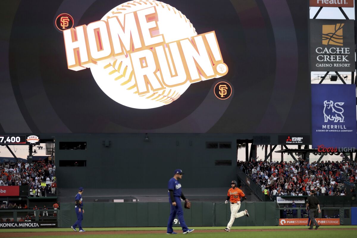 San Francisco Giants' Darin Ruf rounds the bases after hitting a home run against the Los Angeles Dodgers during the fourth inning of a baseball game in San Francisco, Friday, June 10, 2022. (AP Photo/Jed Jacobsohn)