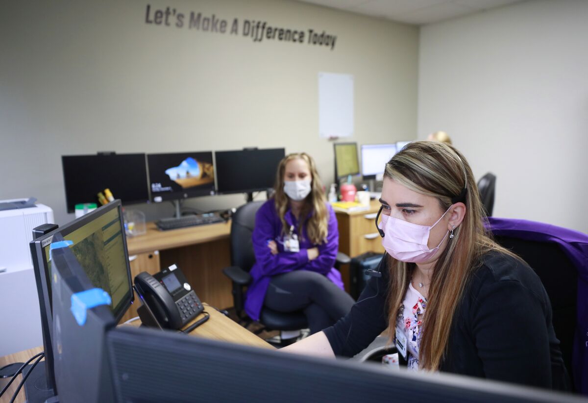 Lauren Muecke, a licensed triage clinician takes a call at the Telecare Mobile Crisis Response Team (MCRT) office.o. 