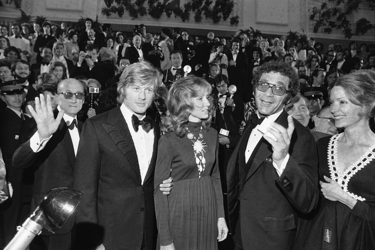 Arriving for the presentation of "Jeremiah Johnson" are, from front left, Robert Redford; his wife, Lola; director Sydney Pollack; and Pollack's wife, Claire Griswold in Cannes, France, May 7, 1972.